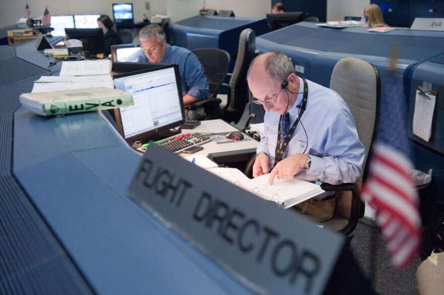 Flight director Paul Dye monitors data at his console in the space shuttle flight control room in the Mission Control Center at NASA's Johnson Space Center during STS-134 flight day two activities. Photo: NASA