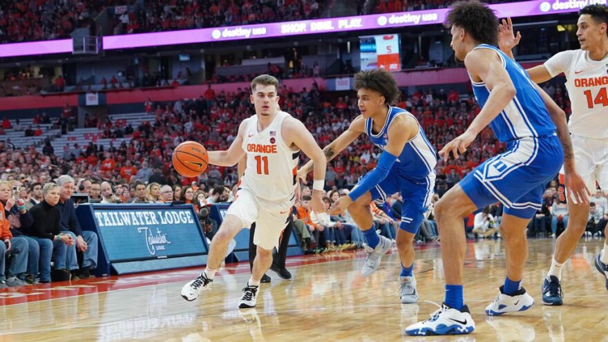 Joe Girard III (11) led Syracuse with 21 points in its 77-55 loss to Duke.