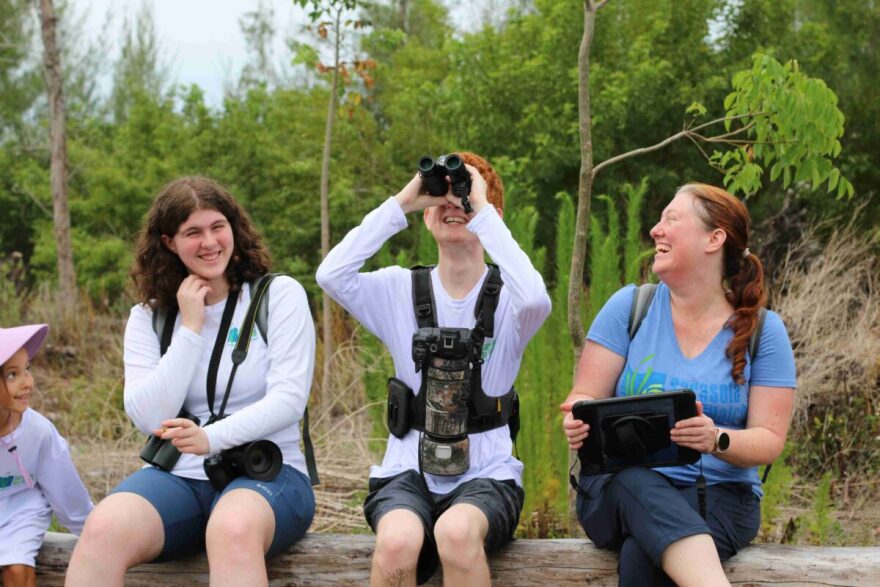 Sophia (left) laughing with friends, Roland Bendever (center) and Tiffany Bendever.