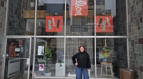 Jen Estill posing in front of the Nelson Gallery on Washington Square