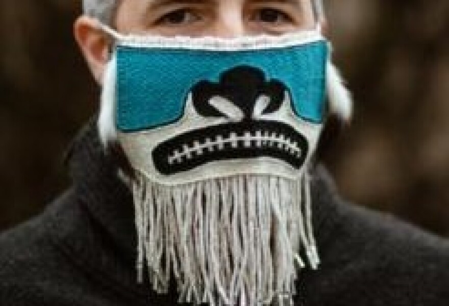 David Eckerson models Lily Hope’s “Chilkat Protector” mask. (Photo by Sydney Akagi)