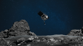 Image rendering shows OSIRIS-REx spacecraft descending toward asteroid Bennu to collect a sample of the asteroid’s surface. (NASA/Goddard/University of Arizona)