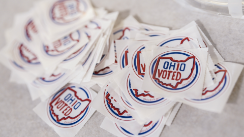 Stickers sit on a table inside a polling location on Election Day, Tuesday, Nov. 7, 2023, in Cincinnati.