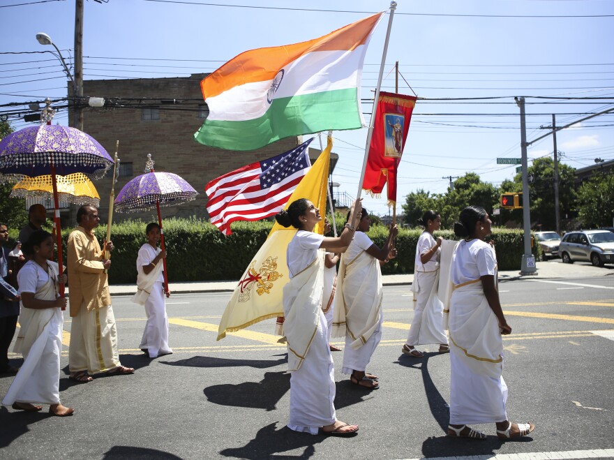 Parishioners parade around the St. Thomas church on the Feast Day of St. Thomas the Apostle last summer, flying the American flag alongside the Indian flag.