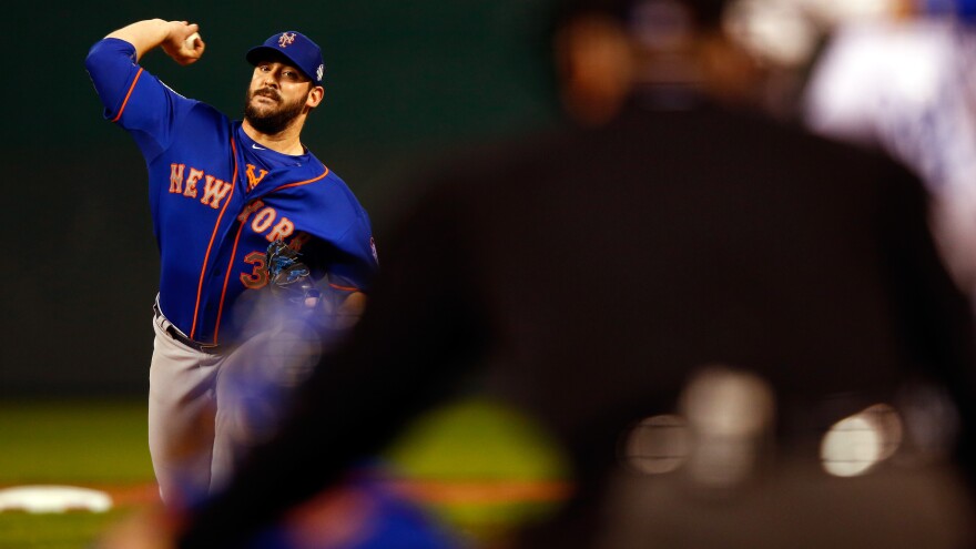 Matt Harvey throws a pitch in the first inning against the Kansas City Royals. Harvey gave up three runs and struck out two in six innings.