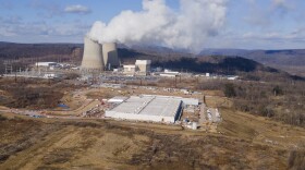 FILE - A data center owned by Amazon Web Services, front right, is under construction next to the Susquehanna nuclear power plant in Berwick, Pa., on Tuesday, Jan. 14, 2024. 