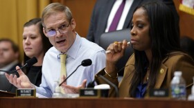 Chairman Jim Jordan, R-Ohio, left, speaks as Del. Stacey Plaskett, D-Virgin Islands, the ranking member, right, listens, during a House Judiciary subcommittee hearing on what Republicans say is the politicization of the FBI and Justice Department and attacks on American civil liberties.