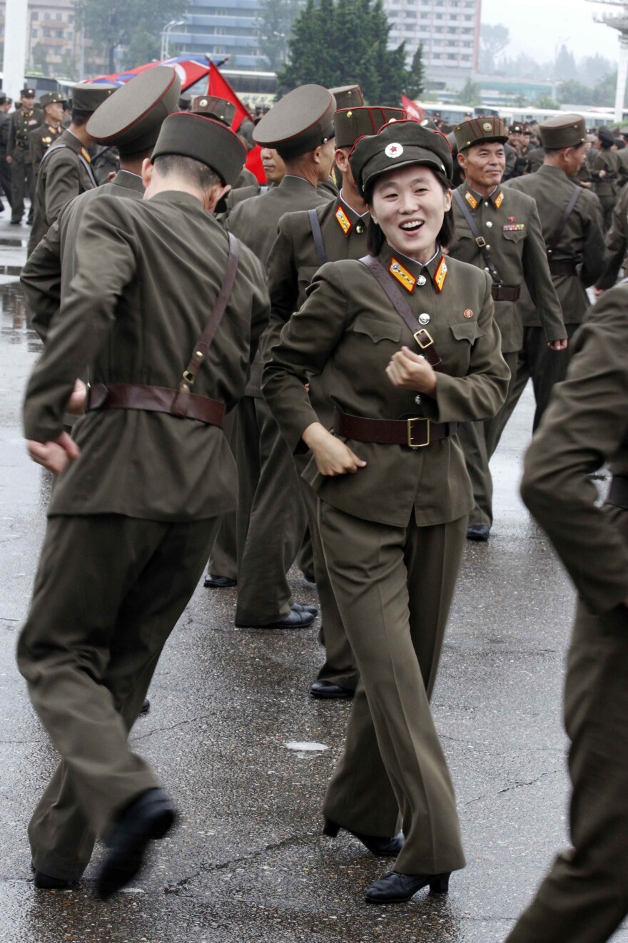 North Korean soldiers dance in the plazas of Pyongyang on Wednesday after the country announced that leader Kim Jong Un was granted the title of marshal.