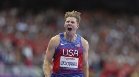 Hunter Woodhall from the U.S. celebrates after winning the men's 400 m. T62 final at the 2024 Paralympics, Friday, Sept. 6, 2024, in Paris, France.