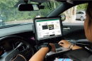 A police officer uses the Flock Safety license plate reader system. Since 2016, the Granite State has had one of the strictest laws in the country regulating and limiting such readers. (Photo courtesy of Flock Safety)