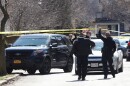 Multiple law enforcement agencies investigate two vehicles on Vassar Street near Park Avenue, that are connected to the officer involved shooting on Barrington Street where a man was killed when officers tried to apprehend him Monday, March 20, 2023. (photo by Max Schulte)