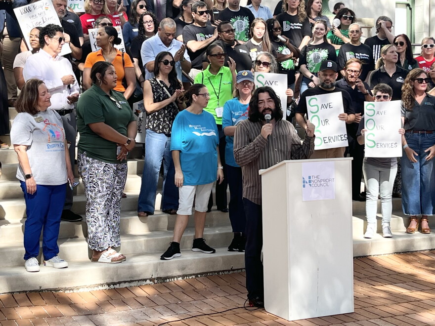 District 4 Councilman Edward Mungia speaks at the rally at City Hall about how potential budget cuts to nonprofits affects residents in all ten districts of San Antonio.
