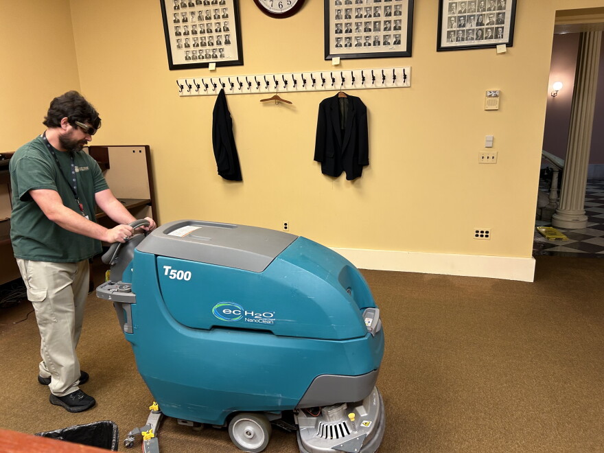 Employees of CSRAB are extracting water from carpets. This is a view of the work being done in the Ohio Legislative Correspondents Association office near the Ohio Senate.