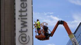 A workman removes a character from a sign on the Twitter headquarters building in San Francisco. Elon Musk has unveiled a new "X" logo to replace Twitter's famous blue bird as he follows through with a major rebranding of the social media platform he bought for $44 billion last year. (Godofredo A. Vásquez/AP)