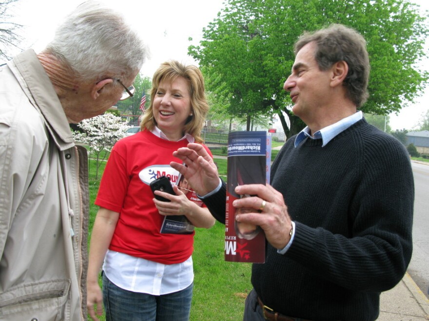 Republican Senate candidate Richard Mourdock (right) speaks with potential voters on March 31 in Evansville, Ind. 