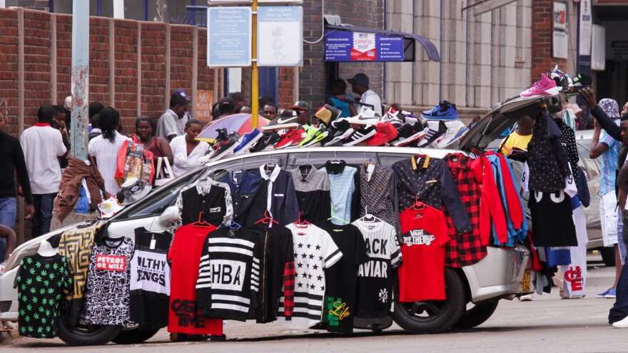 Street hawkers have taken over so many sidewalks in Harare's city center that some vendors are turning their cars into makeshift shops.