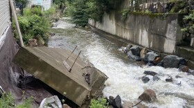 A slab of wall that has fallen into the Highland Brook behind Brian Frederickson's home in Highland Falls.