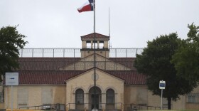 A Texas flag flies in front of the Federal Medical Center prison in Fort Worth, Texas, on May 16, 2020. (LM Otero/AP)