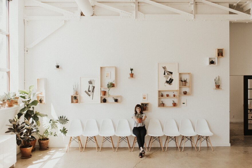 Danielle Raymo, founder of the Rochester Brainery, sits in its Green Room.