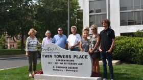 Family of the late developer G. Raymond Becker unveiled a new granite plaque dedicated to him outside the Twin Towers in downtown Peoria.