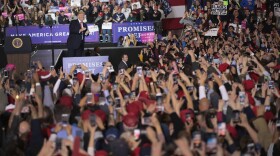 President Trump greets supporters during a campaign rally Saturday in Washington Township, Mich.