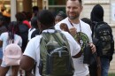 Music teacher, Oliver Smith, greets studenst on the first day of School for the Rochester City School District, Thursday, September 5, at the new Loretta Johnson Middle School, on Genesee Street.