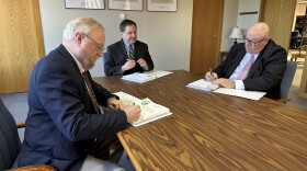 Cole County Circuit Judge Jon Beetem, from left, Missouri Secretary of State Jay Ashcroft and Cole County Circuit Judge Daniel Green review and sign the official results of the November election while meeting as the Board of State Canvassers, at Ashcroft's office in Jefferson City, Missouri, Thursday, Dec. 5, 2024.