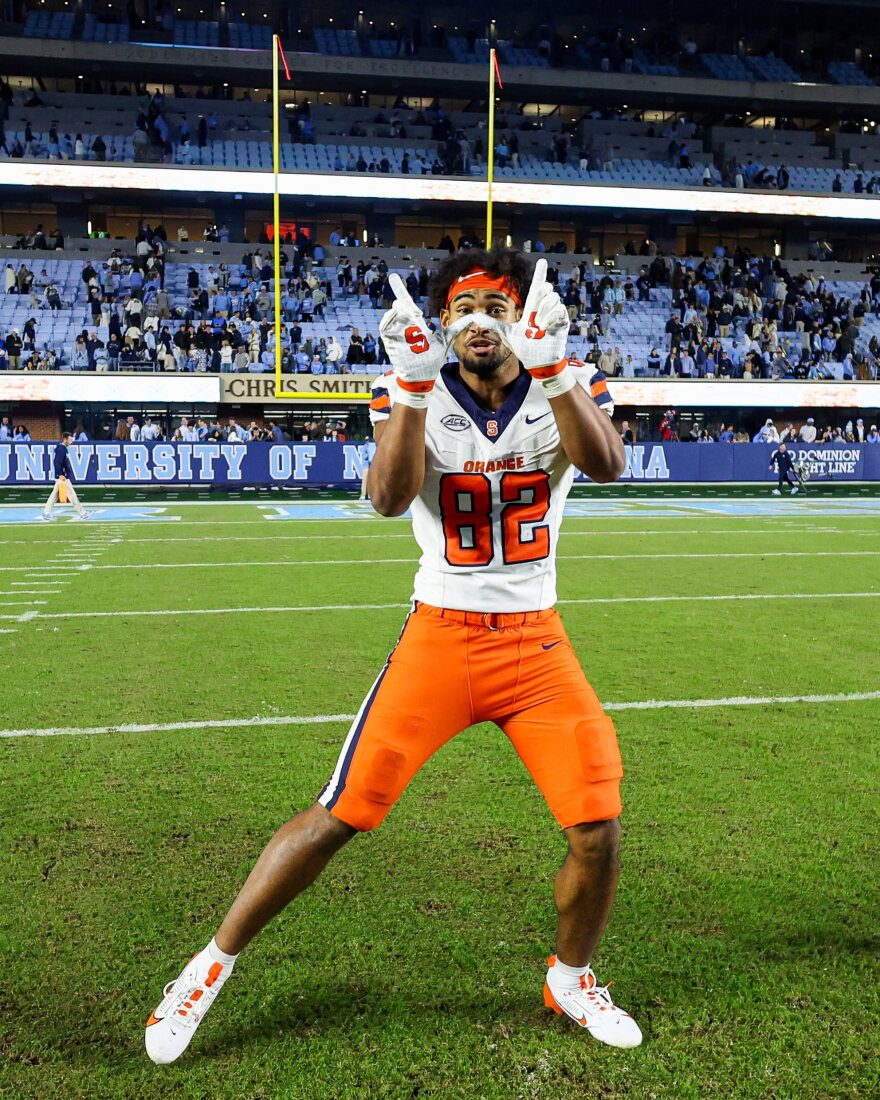 Linebacker Jamie Tremble (82, White) celebrates a victory over UNC on Saturday.