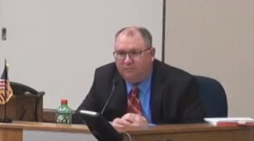 Peoria County Election Commission Executive Director Tom Bride testifies at a board hearing on challenges to nominating petitions for mayoral candidates on Tuesday.