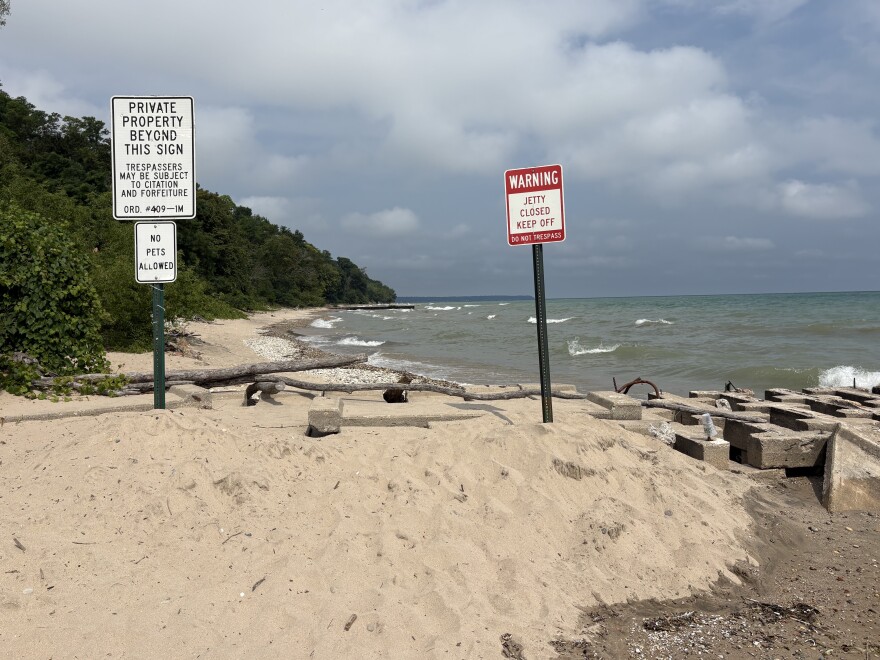 Private property signs on the shore of Lake Michigan.