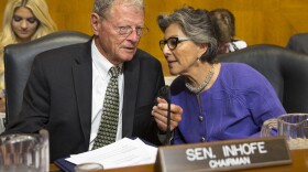 Senate Environment and Public Works Committee Chairman Sen. Jim Inhofe, R-Okla., left, talks with the committee's ranking member Sen. Barbara Boxer, D-Calif., on Capitol Hill in Washington, Sept. 16, 2015.