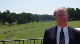 Tom Fazio, standing before Quail Hollow's 18th hole. align=left