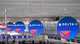 Delta Air Lines signs hang at Minneapolis-St. Paul Airport Monday, March 16, 2026, in Minneapolis. (AP Photo/Abbie Parr)