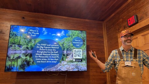 Abe Christian explains the Florida Trail’s pathway at Hogtown Creek Headwaters Nature Center on Sunday, Nov. 2, 2025. The trail begins in Big Cypress National Preserve and ends in Pensacola, he said.