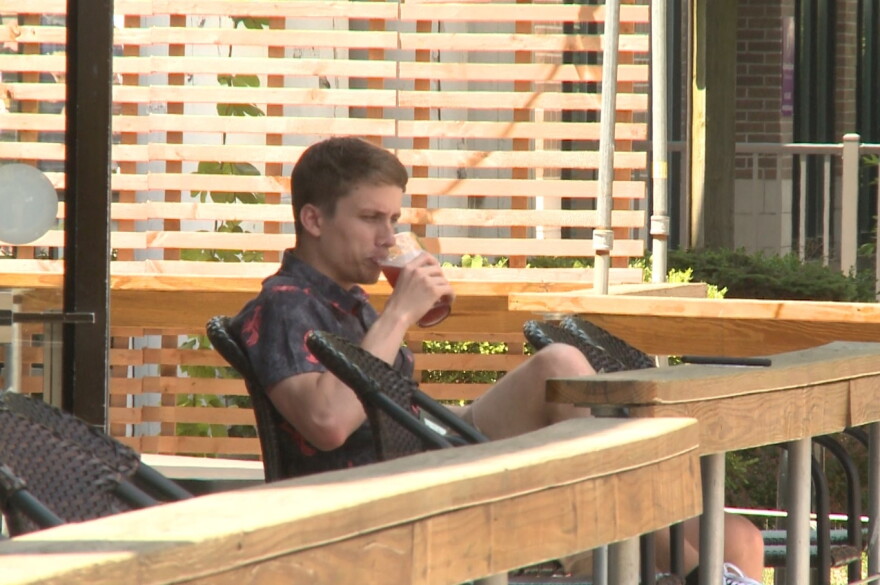 A customer enjoys a beer at Switchyard Brewery in Bloomington on June 15th, 2020.