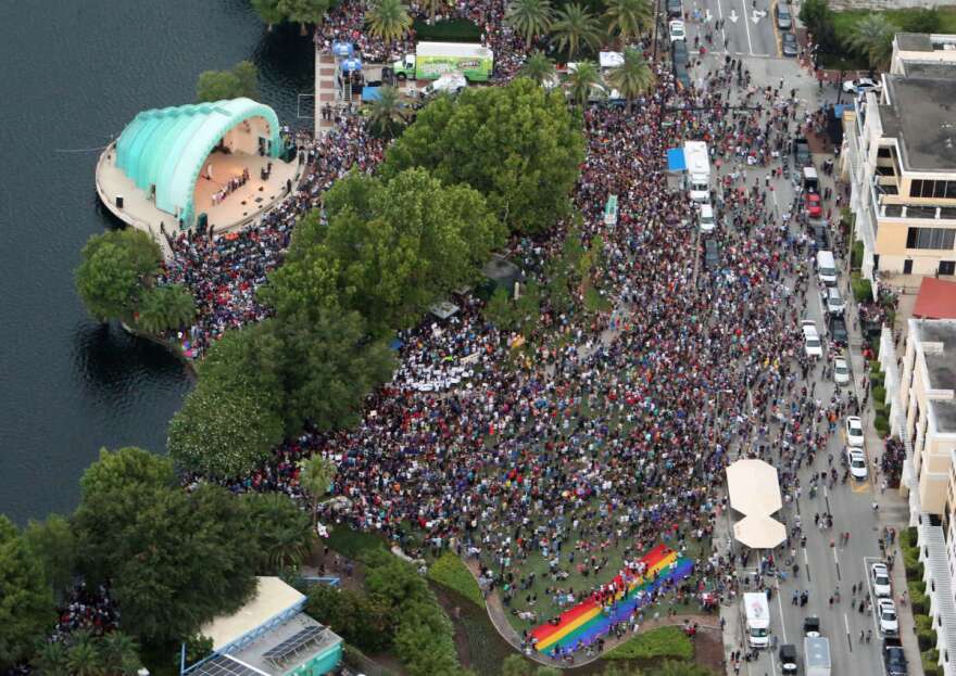 Aerial view of the out pouring of people attending a Pulse nightclub shooting vigil Sunday, June 19, 2016. Orlando City officials are expecting about 20,000 people to attend a vigil at Lake Eola on Sunday night. (Red Huber/Staff Photographer)