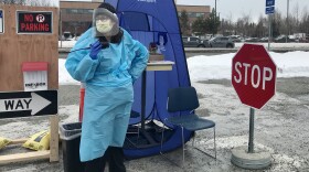 Trish Siza, a resident with Providence Alaska, was the first healthcare provider to greet people in Anchorage seeking drive-thru COVID-19 testing Tuesday, March 17, 2020. (Casey Grove/Alaska Public Media)