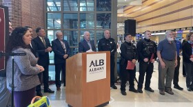 John Bonhatal (R) with the first responders and speakers at Thursday's press conference