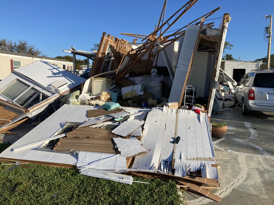 A North Fort Myers mobile home in the path of Hurricane Ian. Neighbors said the people living here had evacuated, but returned Thursday to survey damage, and were devastated by what they found.