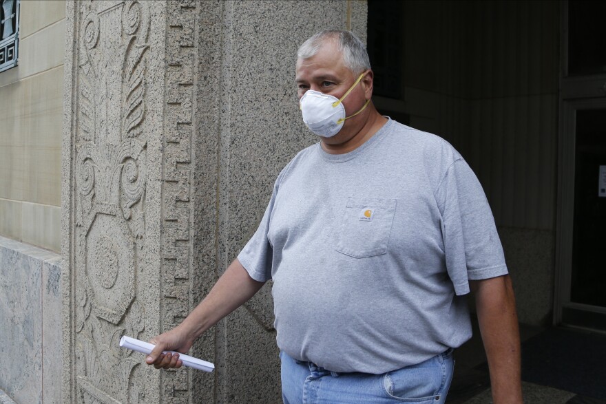 Ohio House Speaker Larry Householder leaves the federal courthouse after an initial hearing following charges against him and four others alleging a $60 million bribery scheme Tuesday, July 21, 2020, in Columbus.