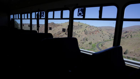 The view from inside a bus looking out at the Warm Springs Reservation.