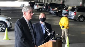 Mayor Chris Koos of Normal and U.S. Senator Dick Durbin talk with reporters about the need for electric vehicle infrastructure.