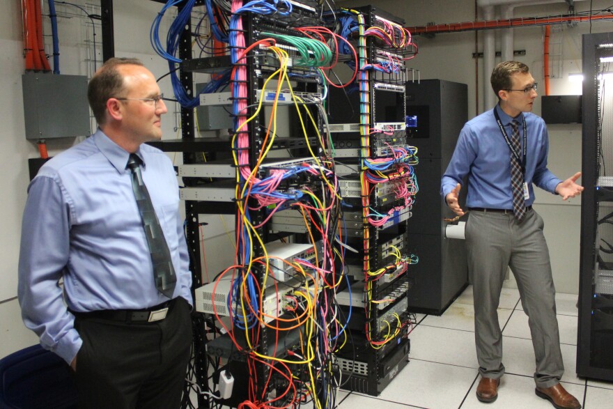 Kenai Peninsula Borough School District Director of Information Services Eric Soderquist and Jordan Chilson explain the district's data center on Wednesday, Aug. 20, 2025 in Soldotna, Alaska.
