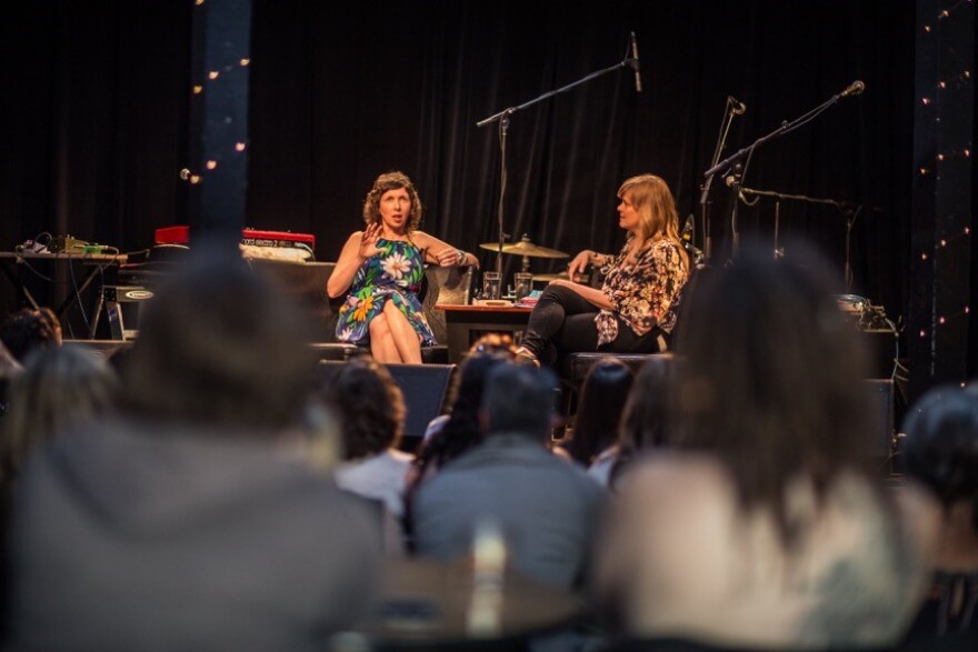 Author Kimberly Harrington speaks with moderator was Autumn Spencer about her previous book, "Amateur Hour: Motherhood in Essays and Swear Words" at Arts Riot in Burlington in 2018.