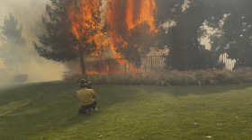 A Sandy Fire flareup in a small park between some homes in eastern Ventura County Tuesday afternoon.