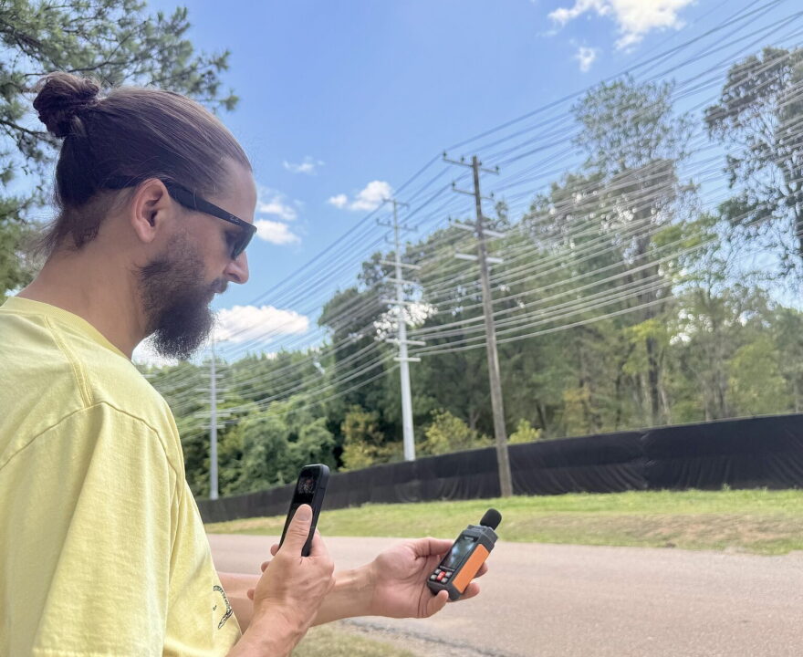 Jason Haley records noise levels emanating from xAI’s gas turbines in Southaven, Mississippi, on Aug. 14, 2026.