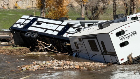 A flooded campground and damaged RVs.