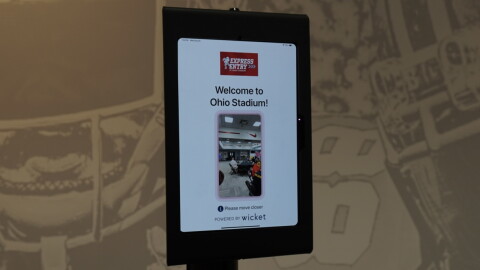 An iPad on a stand with the word "Welcome to Ohio Stadium!" and a digital viewfinder.