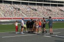 McDonald and community runners prep at the Charlotte Motor Speedway.