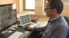 Indiana University Professor Chen Zhu shows how people can use the mapping tool to find out how much water might be lost in their community in the future.